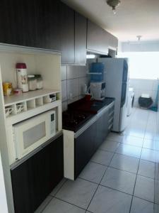 ครัวหรือมุมครัวของ Apartamento aconchegante no Jardim Paulistano