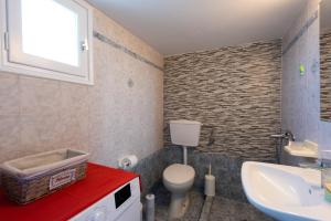 a bathroom with a toilet and a sink at «MARMARA» house in Cherronisos