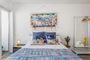 Łóżko lub łóżka w pokoju w obiekcie Pop Art, Apartamentos de diseño en Arenal