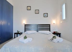 Letto o letti in una camera di Elea Apartments