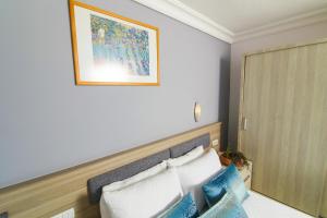 Ein Bett oder Betten in einem Zimmer der Unterkunft Dalyan Hotel Nish Caria