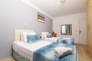 Ein Bett oder Betten in einem Zimmer der Unterkunft Dalyan Hotel Nish Caria