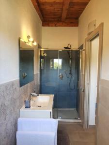 a bathroom with a shower and a sink and a shower at Affittacamere Samar in San Teodoro