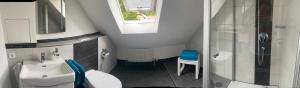 a small bathroom with a sink and a shower at Ferienwohnung Heide in Freudenstadt +24 photos