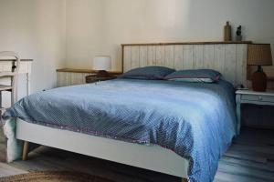 Postel nebo postele na pokoji v ubytování Gîte indépendant dans villa entre mer et maquis