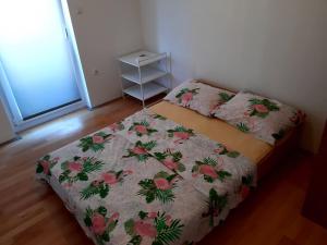 Postel nebo postele na pokoji v ubytování Apartmani Ivan