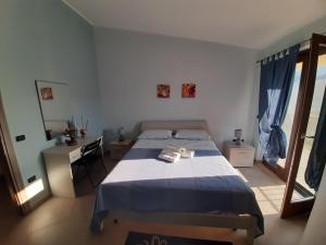 Posteľ alebo postele v izbe v ubytovaní B&B CASA MARTINA