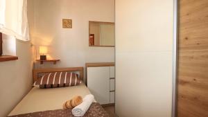 Postel nebo postele na pokoji v ubytování Apartmani Meri