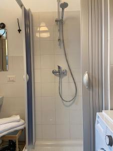 a shower with a shower head in a bathroom at I Tre Archi in Grottaminarda