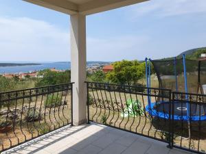 a balcony with a view of the ocean at Villa Malena in Rab