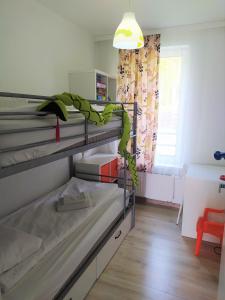 Postel nebo postele na pokoji v ubytování M&K Apartamenty Zielony Zakątek - Sobieszewo