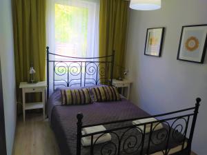 Postel nebo postele na pokoji v ubytování M&K Apartamenty Zielony Zakątek - Sobieszewo