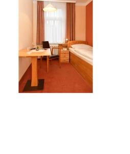 Postel nebo postele na pokoji v ubytování Panoramahotel Wolfsberg