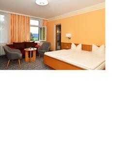 Postel nebo postele na pokoji v ubytování Panoramahotel Wolfsberg