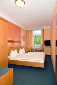 Postel nebo postele na pokoji v ubytování Panoramahotel Wolfsberg
