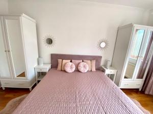 Posteľ alebo postele v izbe v ubytovaní Do-Ti Apartmanház Balatonlelle