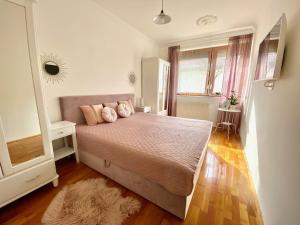 Posteľ alebo postele v izbe v ubytovaní Do-Ti Apartmanház Balatonlelle