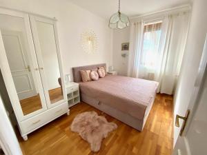 Posteľ alebo postele v izbe v ubytovaní Do-Ti Apartmanház Balatonlelle