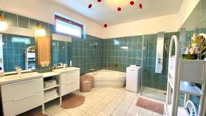 Kúpeľňa v ubytovaní Do-Ti Apartmanház Balatonlelle