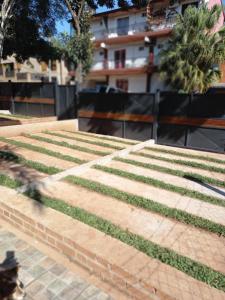 a dog is walking down the stairs in a city at Amambay Apart &Suites in Eldorado