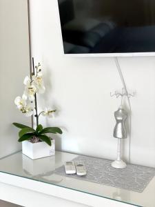 Televízia a/alebo spoločenská miestnosť v ubytovaní Do-Ti Apartmanház Balatonlelle