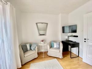 Televízia a/alebo spoločenská miestnosť v ubytovaní Do-Ti Apartmanház Balatonlelle
