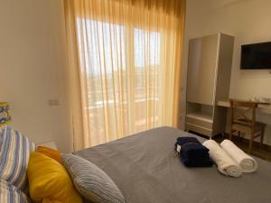 Cama o camas de una habitación en B&b Animo Mediterraneo