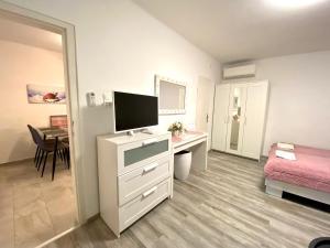Posteľ alebo postele v izbe v ubytovaní Do-Ti Apartmanház Balatonlelle