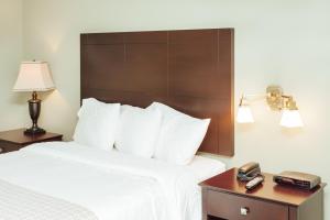 Voodi või voodid majutusasutuse The Grand Hotel Nanaimo toas