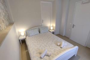 Postel nebo postele na pokoji v ubytování Vatos 2 bedroom apartment