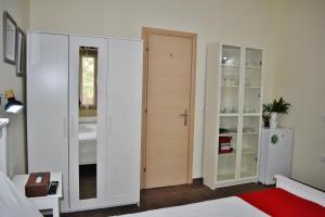 a bedroom with a closet and a door at Kripis Studio in Pefkochori