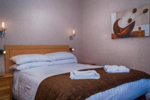 Letto o letti in una camera di Sutherland House
