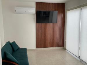 TV a/nebo společenská místnost v ubytování Vamos a Mazatlán Casa vacacional