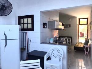 Η κουζίνα ή μικρή κουζίνα στο Apartamento Maranduba Ville II