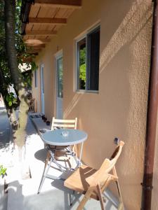 a table and chairs sitting on a patio at Casa Elena in Corbu