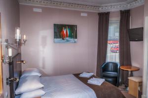 Letto o letti in una camera di Sutherland House