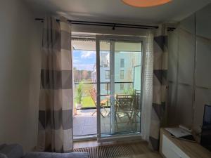 Televízia a/alebo spoločenská miestnosť v ubytovaní Apartament Swing