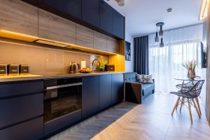 Kuchyňa alebo kuchynka v ubytovaní Apartament Nadmotławie 34