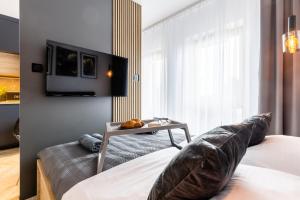 Posteľ alebo postele v izbe v ubytovaní Apartament Nadmotławie 34