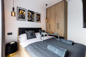 Posteľ alebo postele v izbe v ubytovaní Apartament Nadmotławie 34