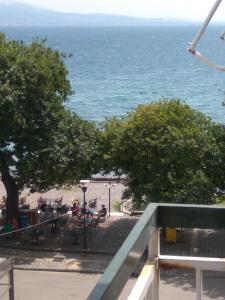 a view of the ocean from the balcony of a resort at NAFPAKTOS Beach luxury Suites in Nafpaktos