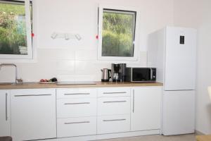 Kuchyň nebo kuchyňský kout v ubytování Sunset Sea View Villa 3