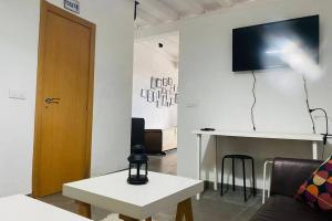 A television and/or entertainment centre at Casa Curias, para 7 personas en Molinillo
