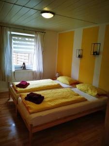 Postel nebo postele na pokoji v ubytování Sonnengarten