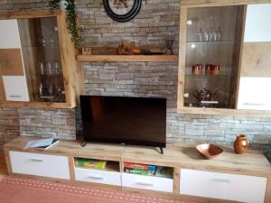 a large entertainment center with a flat screen tv at Alpina Inzell 223 in Inzell