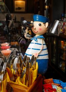a figurine of a sailor with a telescope at Inn in the Park in Bournemouth