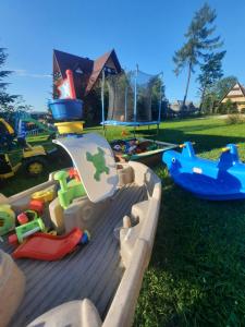 a childs play area with toys in a park at Apartament U Maćków in Murzasichle
