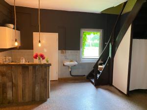 a bathroom with a sink and a window at Landhaus Viezer Mühle in Viez