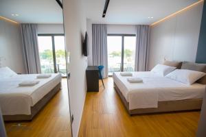 Postel nebo postele na pokoji v ubytování Delight Hotel