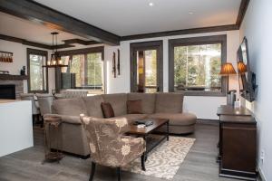 a living room with a couch and a table at The Seasons 1818 condo in Keystone